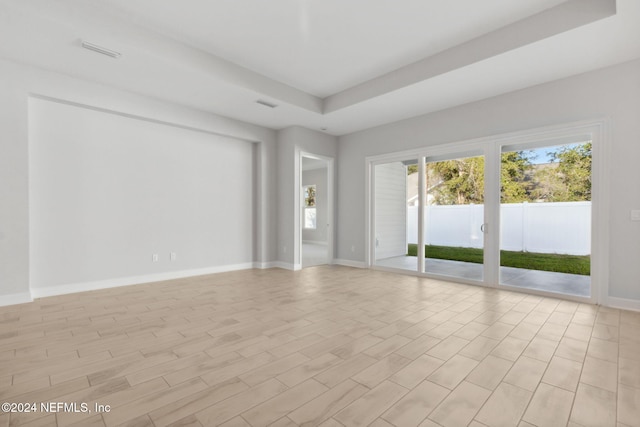 spare room with light hardwood / wood-style flooring