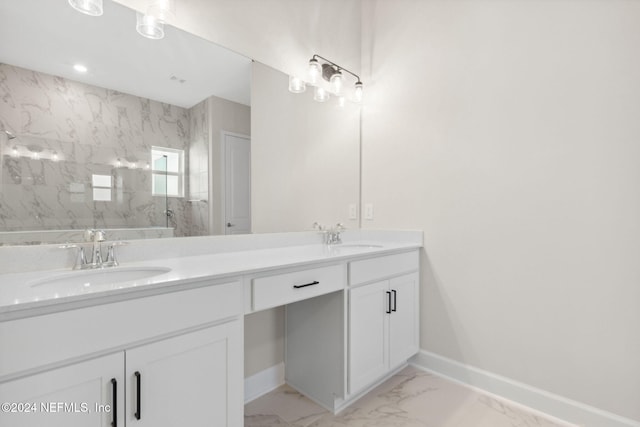 85212 Sandy Ridge Loop Unit 0023, Yulee, FL 32097 - bathroom featuring baseboards, marble look tiles, a marble finish shower, and double vanity