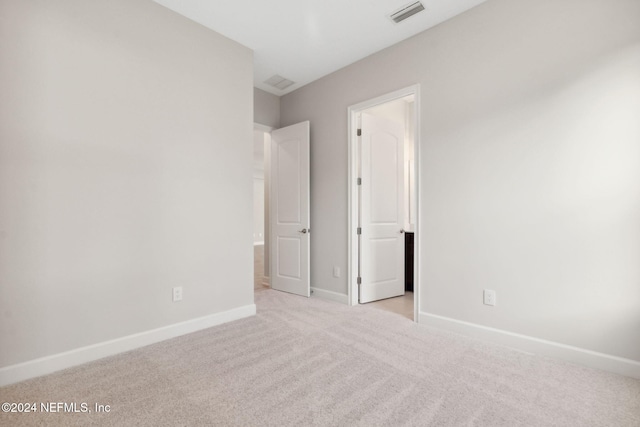 85212 Sandy Ridge Loop Unit 0023, Yulee, FL 32097 - unfurnished bedroom with carpet flooring and baseboards