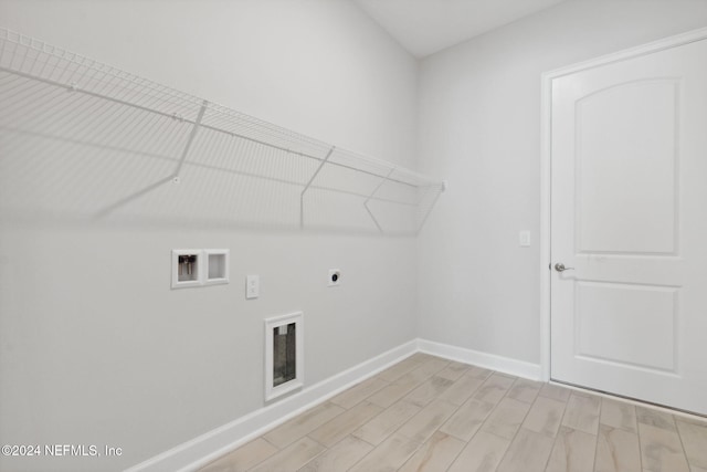 clothes washing area featuring washer hookup, light wood-type flooring, and electric dryer hookup