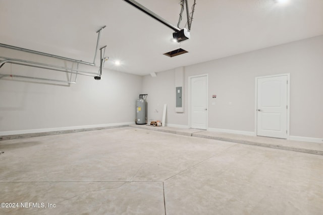 garage featuring electric panel, a garage door opener, and water heater