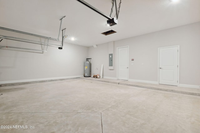 85212 Sandy Ridge Loop Unit 0023, Yulee, FL 32097 - garage featuring water heater, electric panel, a garage door opener, and baseboards