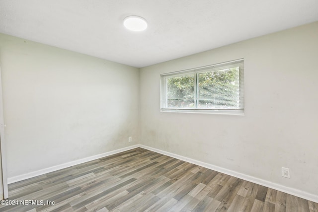 5246 Devron Dr, Jacksonville, FL 32209 - empty room with wood finished floors and baseboards