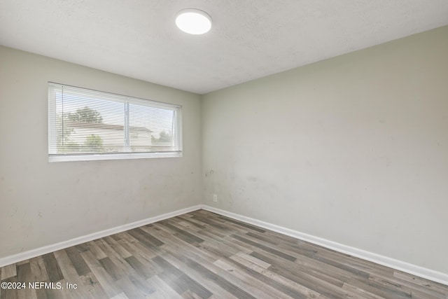 5246 Devron Dr, Jacksonville, FL 32209 - unfurnished room featuring wood finished floors and baseboards