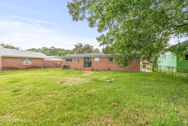 5246 Devron Dr, Jacksonville, FL 32209 - back of house with brick siding and entry steps