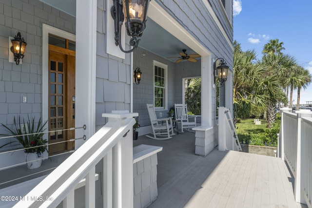 balcony with ceiling fan and a porch