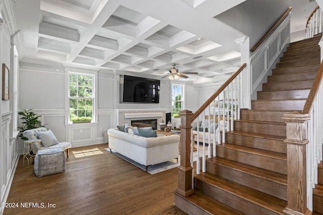 interior space featuring beamed ceiling, coffered ceiling, hardwood / wood-style floors, and ceiling fan