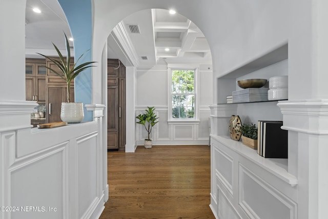 entrance foyer featuring beam ceiling, coffered ceiling, and dark hardwood / wood-style flooring