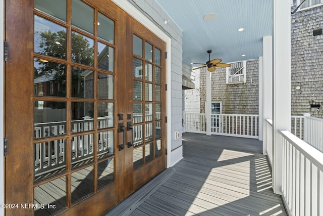 balcony featuring cooling unit, ceiling fan, and french doors