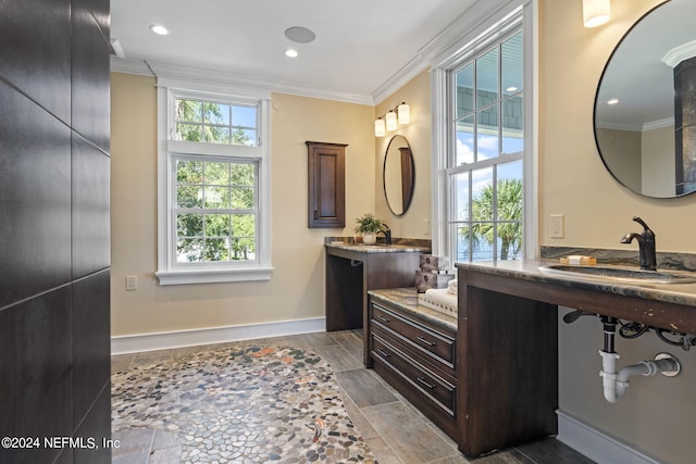 bathroom featuring vanity and ornamental molding