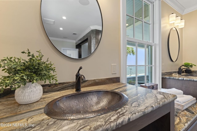 bathroom with vanity and ornamental molding