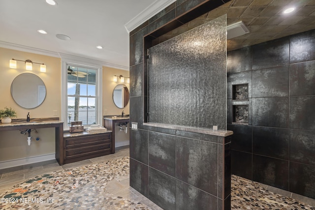 bathroom featuring walk in shower, ornamental molding, and vanity