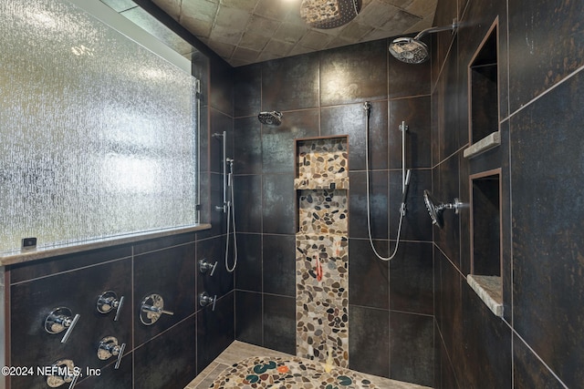 bathroom with tiled shower