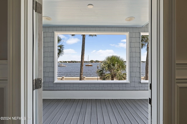 wooden deck with a water view