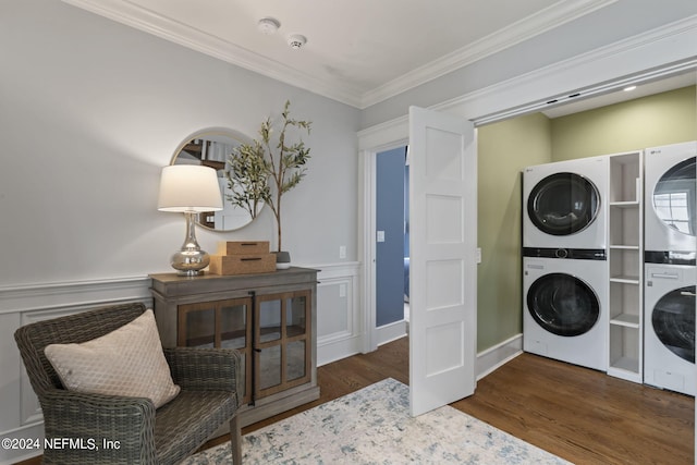 clothes washing area with crown molding, stacked washing maching and dryer, and dark wood-type flooring