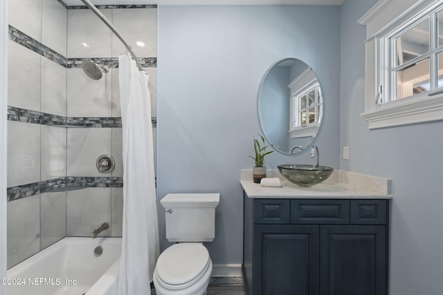 full bathroom featuring vanity, toilet, and shower / bath combo with shower curtain