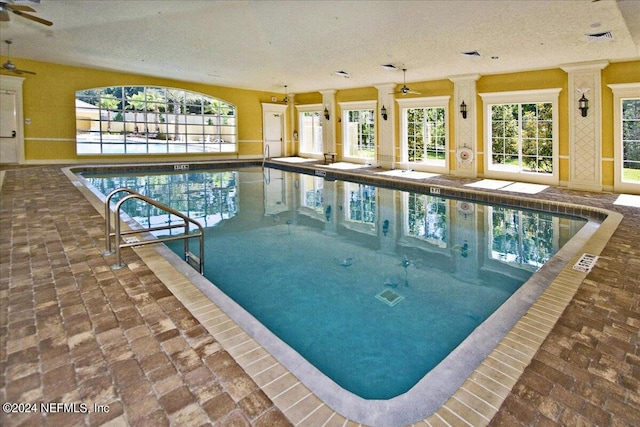 view of swimming pool featuring ceiling fan