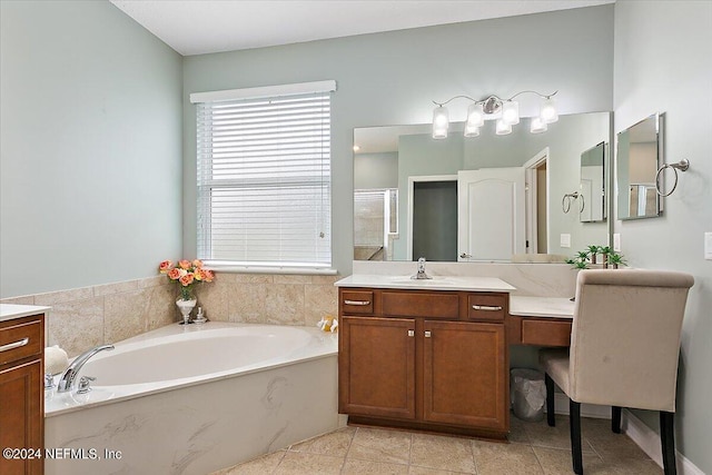 bathroom featuring tile patterned flooring, independent shower and bath, and vanity