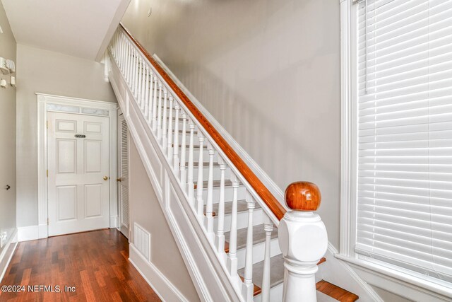 stairway featuring hardwood / wood-style floors