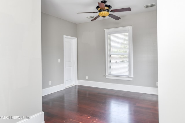 unfurnished room featuring ceiling fan and dark hardwood / wood-style flooring