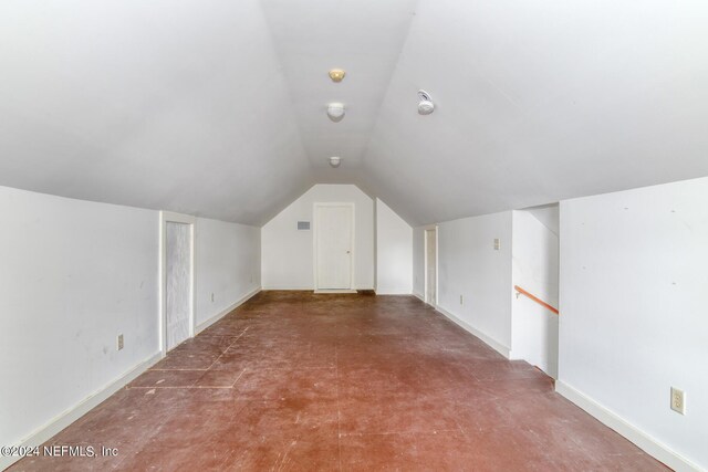 bonus room featuring lofted ceiling