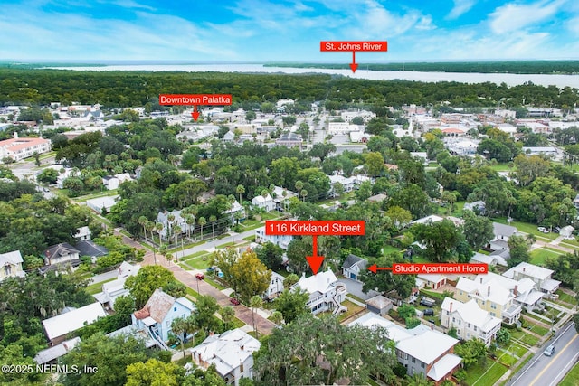 birds eye view of property with a water view