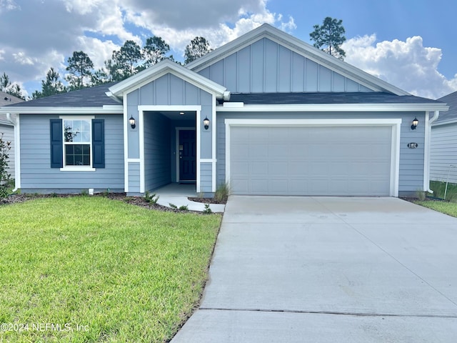 ranch-style home with a front lawn, a garage, board and batten siding, and driveway