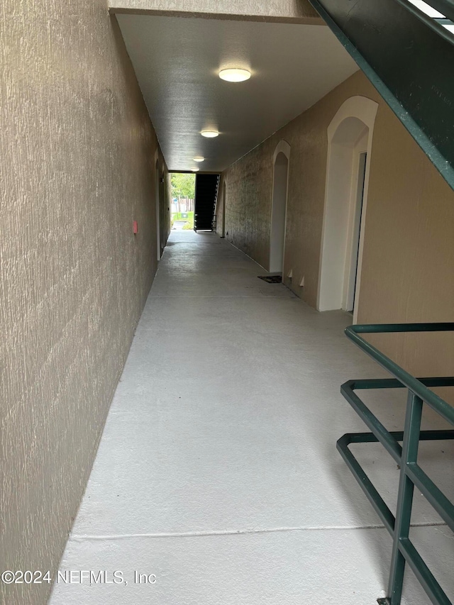 corridor featuring concrete flooring