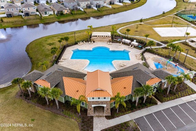 view of pool featuring a water view