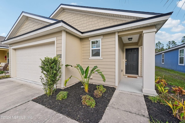 view of front of property with a garage