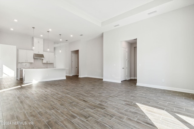 unfurnished living room with light hardwood / wood-style flooring