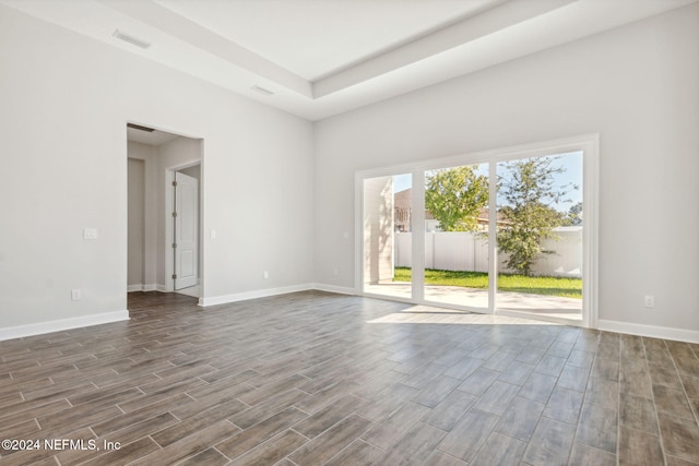 unfurnished room with dark hardwood / wood-style floors