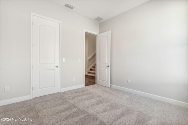 unfurnished bedroom with carpet flooring