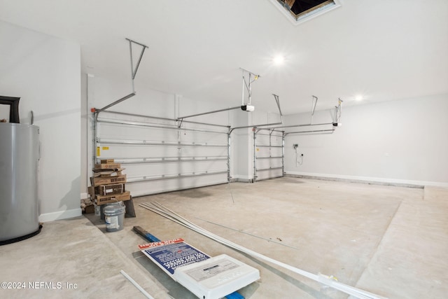 garage with electric water heater and a garage door opener