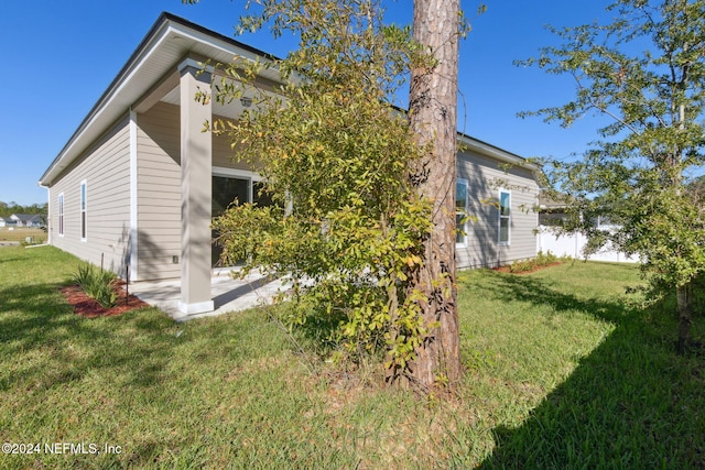 rear view of house with a yard