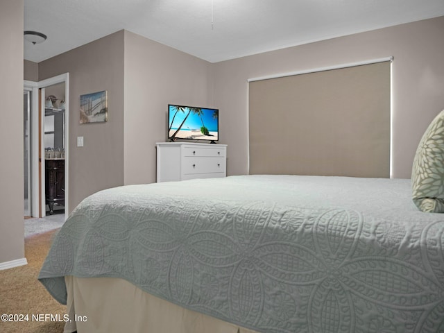 bedroom with light colored carpet