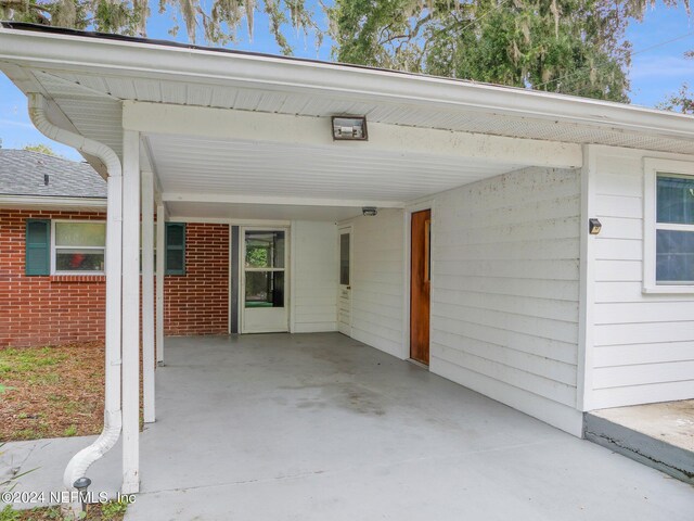 exterior space featuring a carport