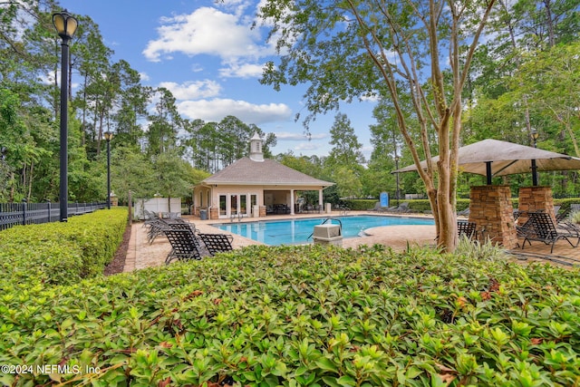 view of swimming pool featuring a patio area