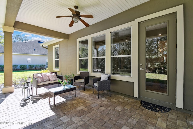 view of patio featuring an outdoor living space and ceiling fan