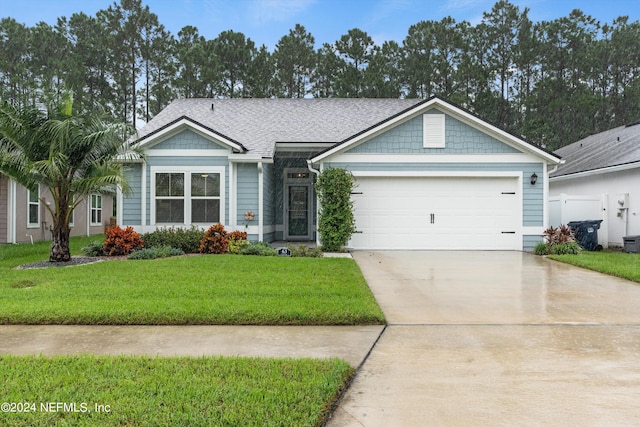 view of front of property featuring a front lawn, a garage, and central AC unit