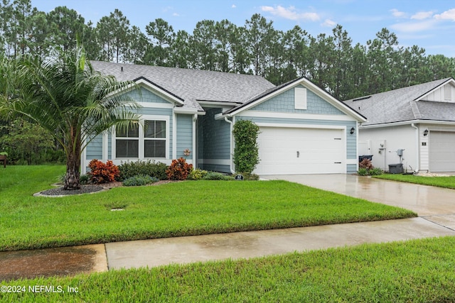 view of front of property with a garage, a front yard, and central air condition unit