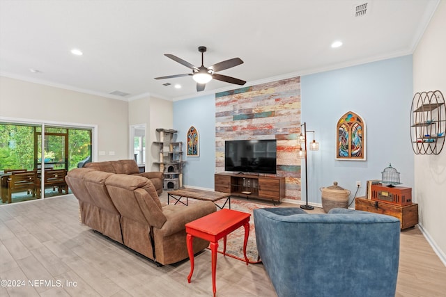 living room featuring crown molding, ceiling fan, and light hardwood / wood-style floors