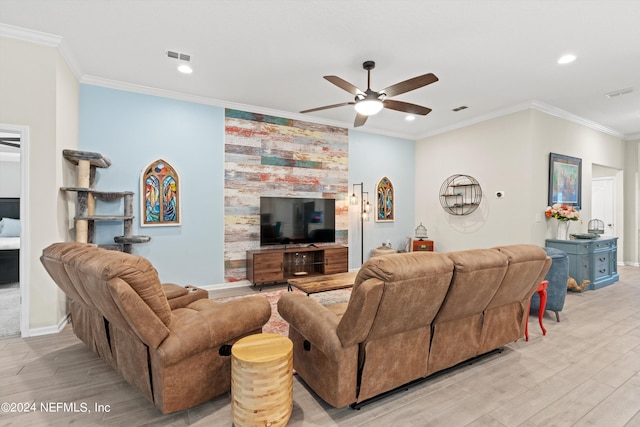 living room featuring a fireplace, ceiling fan, ornamental molding, and light hardwood / wood-style floors