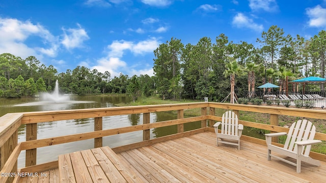 wooden deck featuring a water view