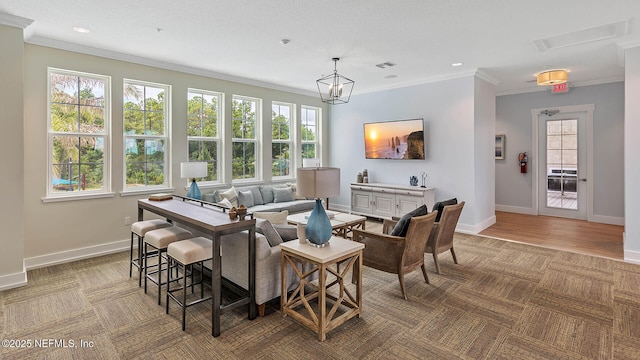 dining room with ornamental molding and light hardwood / wood-style floors