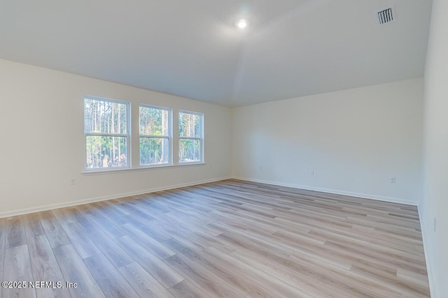 empty room with light hardwood / wood-style floors