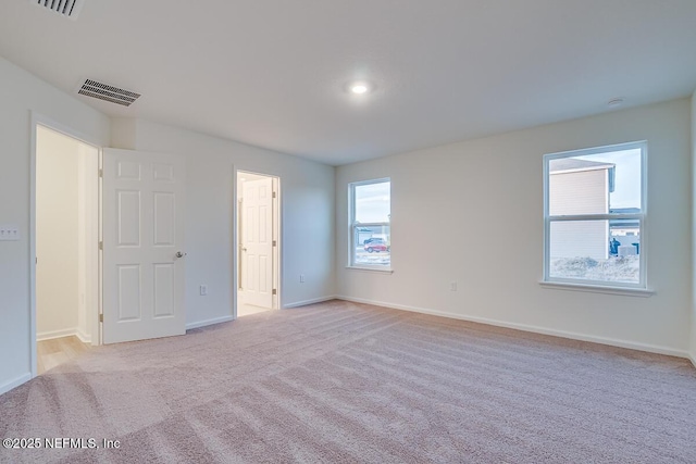 empty room with light colored carpet