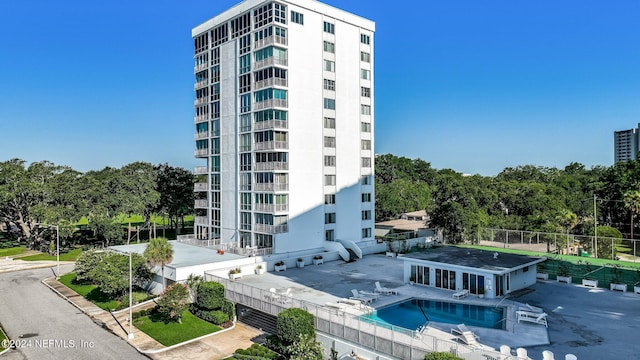 view of building exterior with a community pool