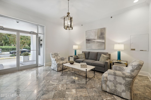 living room featuring ornamental molding and an inviting chandelier