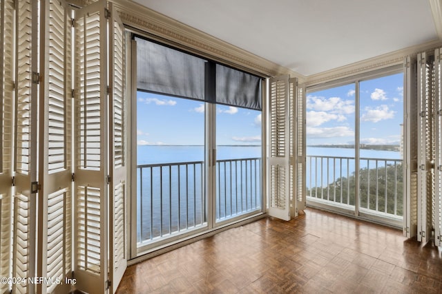 unfurnished sunroom featuring a water view and a healthy amount of sunlight